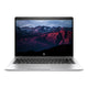 HP laptop with a mountainous landscape on the screen against a white background