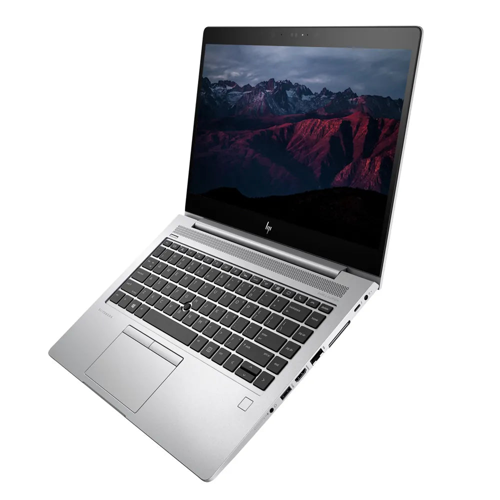 Laptop with a scenic mountain display on a white background