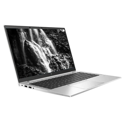 Laptop with a waterfall image on the screen against a white background