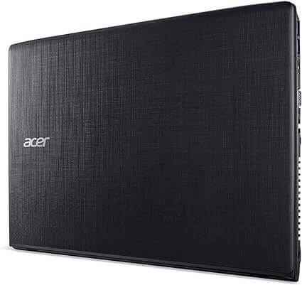 Acer Aspire E5-576 15.6" laptop with black finish, second hand laptops UAE, refurbished computers Dubai, rear view closed lid.